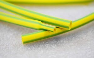Image of 9mm yellow/green heat shrink tubing, 100m roll, used for earth wire insulation